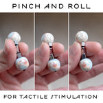 Pinch and rolling stim toy made of crystals and steel